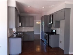 Kitchen walls painted white and cabinets painted gray